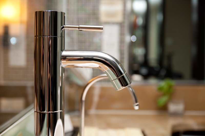 Leaking tap being repaired in Highgate